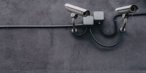two gray bullet security cameras